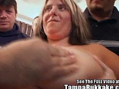 A chubby, busty brunette with huge tits is with a bunch of dudes and gets felt up before she starts sucking them off and taking a ton of cum all over her face. Then she shakes her titties and they are big!