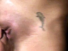 Wonderful blonde babe Cindy Hope showing off her body with her cute dolphin tattoos on her pussy and is being pleased by a muscular guy that is licking her pussy very hard and nice.
