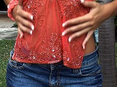 She is extremely alluring woman with sexy tanned body. She plays with herself on a loan outdoor. Lifting up her skirt she inserts her fingers in the snatch pleasuring herself.