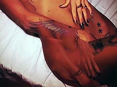 Lovely erotic naked tattooed girl