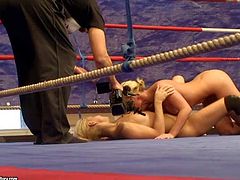 Attractive blonde hotties Kathia Nobili and Brandy Smile with delicious asses and natural boobs get naked during rough fight and start licking each other on the floor in ring