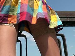 Having her naughty panties revealed during upskirt filming her makes voyeur to get horny