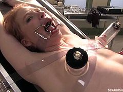 Redhead hottie Madison Young lets salacious Mark Davis tie her up to a gynecological chair. Then Mark pulls the bitch by her pussy lips and makes her suck his dick before he pokes it in her snatch.