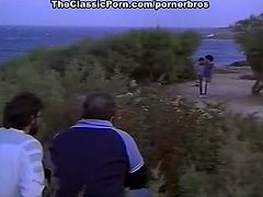 This Italian couple is having sex on the beach while two other men watch them fucking and jerk off.