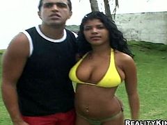 Ardent Latina chick plays football. Horny nympho in yellow bikini wanna relax a bit. All sweaty busty hooker undresses, shows her smooth ass, sweet boobs and wanna seduce a man for casual sex right on the lawn.