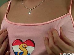 Flat breasted brunette teen pinches her small nipples under the shirt before she takes off her mini skirt to demonstrate subtle frame in perverse sex video by Club Seventeen.