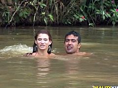 Aroused wanker cannot take his hands and mouth off a frisky Latin milf with curvy frame while they swim in a pond. He rubs her juicy ass while giving her an erotic massage.