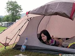 This cute 17 year old girl is half naked inside her tent. She is rubbing her pussy until she has an intense orgasm.