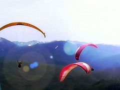 These badass blonde and brunette bitches agree that the first order of doing paragliding right is to get naked and the guy guides have no argument with that, check out the high flying action.