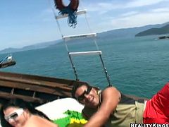 Reality Kings sex clip provides you with a really hot and horny brunette in sunglasses. This awesome nympho gets oil covered. Sunbathing nympho in in bikini enjoys getting her tits jammed, ass rubbed and pussy tickled right on the yacht.