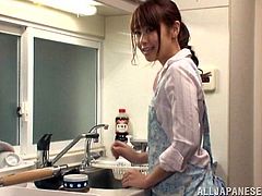 Sexy Japanese chick Maika is having fun with a delivery boy in the kitchen. She has no money to pay for the pizza so she suggests the dude to give him a blowjob.