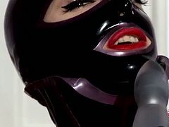 Slaty busty babe in latex costume and high heel boots with her head totally covered with mask gives a head to dildo before she uses it to fuck her ruined pussy in DDF Network sex session.