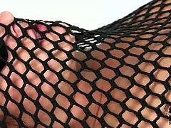Perverse brunette slut covers a flat breasted bitch with fishnet. Later she attaches dildo to her pubis and starts riding it in reverse cowgirl style.