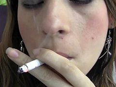 Smoking while posing her sexy forms only makes her horny and eager for action