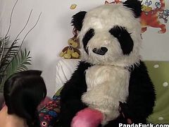 A big toy panda fucks this teen babe with his big plastic cock. He cums on her pretty face after fucking her.
