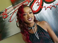 Skin Diamond is s red-haired ebony chcik with sexy long legs and round ass. She poses in short black dress and shows all her tattoos in a flirtatious manner. Watch and enjoy!