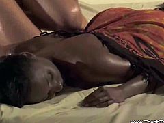 Gentle massage technique for anal and pussy relaxation and stimulation as a white guy massages his ebony girlfriend by the pool in this interracial free tube video.