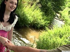 Romantic brunette in pink dress sits near the stream. Palatable girlie with splendid body and nice butt sees a dude approaching to her. Talkative guy seduces pretty gal and she pulls up her skirt to get her already wet pussy tickled right outdoors.