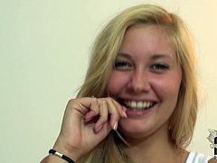 Curvy blond amateur takes off her clothes in front of a horny man with a cam in his hands before she lies on the snow white couch to stroke her big firm tits and finger her shaved vagina.