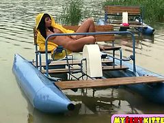 A stunning brunette teenie takes off her sexy black panties and starts rubbing her tight pussy. She wants to cum for you on the water bike!