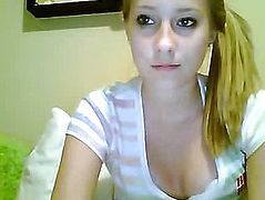 Blonde in a striped blouse sitting in front of webcam