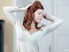Mia Sollis is a beautiful long haired teen redhead that strips down to her black underwear and bares her perky natural tits in a playful manner. Watch attractive young babe strip.