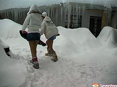Playful dykes have fun with snow outdoor. As they get horny they start teasing one another for sex. So one of the girls goes down on her knees eating her lover right there and then.