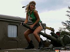 Kinky blonde soldier with hell seductive appeal is going dirty in Seventeen Video clip. She poses on cam having military truck on a background.