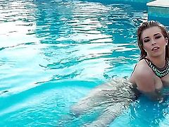 Lovely hottie with massive knockers Jodie Piper enjoys relaxing naked in a pool on a warm summers day