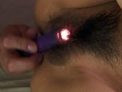 Steamy Japanese hoe Manami Komukai gets her hairy pussy aroused with vibrator