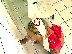 Turned on lusty cheep looking blonde nurse Cherry Kiss with heavy make up and french manicure in latex uniform takes on stiff cock at the glory hole and sucks it good.