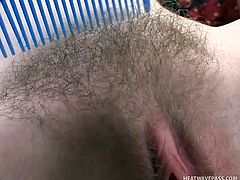 Wearing nothing but her high heels the milky white blonde shows us how nicely she can brush her very hairy vagina. This bitch knows what we want to see from her and after taunting us with that hot bush she receives a pussy lick from her man and then kneels to suck him. Now she bends for fucking!