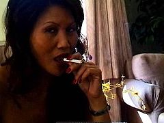 Sweet asian mom loves posing nude while smoking and undulating her body
