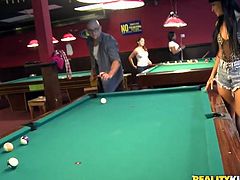 Kinky brunette girl is ready to show you her juicy tits. She plays billiard and flashes her tits in public. Watch exciting Reality kings sex video for free.