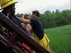 These four firemen get rewarded by two teens for the great job they've done. They are tongue kissing.
