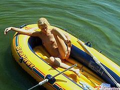 Skinny Russian blonde sails in the middle of lake on her boat in order to have a chance for hot solo masturbation. She hand strokes her small perky tits before she moves her fingers towards shaved vagina for a finger fuck.