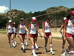 Sexy bitches are wearing sporty costumes looking hell seductive. They are working out on a field while a bunch of studs is watching them from voyeur seats.