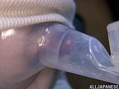 Nasty Japanese chick decants her milk in a special plastic bottle. After that she takes a vibrator and plays with her pussy.
