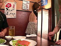 Naughty Japanese girl in housemaid uniform flashes her tits and then gives a handjob to a guy in a cafe. Then this babe gets her tits covered with cum.