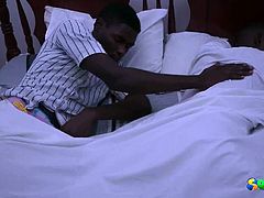 Check out these horny african studs cuddling on the kingsize bed. They start taking off their clothes and jerk of each other's uncut cocks!