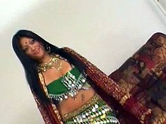 Kinky chick wearing national Indian gown pleases her pussy