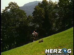 Check out this scene from a vintage german porn movie. Young blonde slut shows her natural tits outdoors on the field!