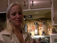 Nasty blonde shows off her ass and shaved pussy in the kitchen