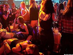 Slutty party lesbians touching their hot bodies with lust and licking their slick muffs in a club