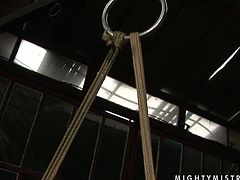 Jaw dropping brunette babe gets suspended in the air while being bandaged by voracious domina before the latter attaches pins to her nipples in peppering BDSM-styled sex video by 21 Sextury.