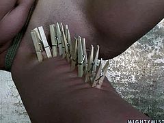 Insatiable brunette domina with a steamy appearance gives bad times to a spoiled blond MILF. She ties her with a rope before suspending in the air. Later she pins her body with clothing pegs in sultry BDSM-involved sex video by 21 Sextury.