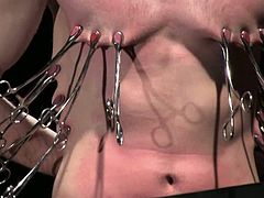 There's some pretty fucked up torture in this gay BDSM video where the submissive guy gets tied, nipple tortured and more.