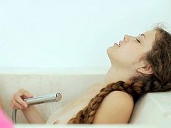 Small tits Vanessa enjoys using her shower to masturbate that warm and tight cunt