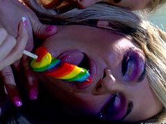 Two naughty blondes share a candy and much more. These whores love to taunt each other, before getting real. After licking that candy one of the hot whores spreads her legs and her girl slides it between her pussy lips. Don't miss this hot action!