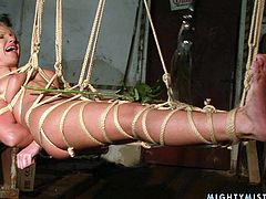 Sex-starved bimbo Angela hangs suspended by ropes over the floor and she is completely at the mercy of her mistress. Check out this hot BDSM scene and get ready to cum.